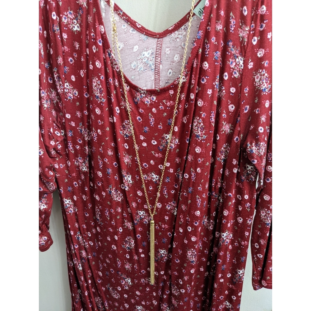 Lightweight floral dress with gold colored necklace attached